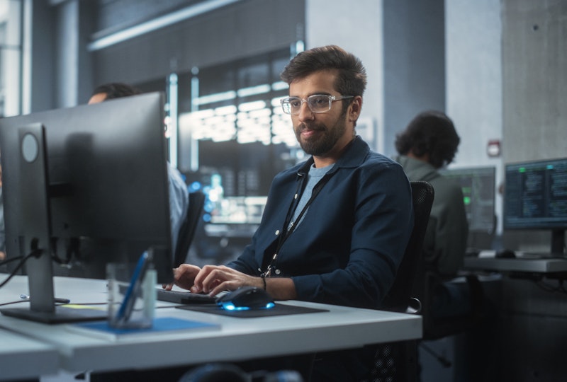 Engineer Using Desktop In Office