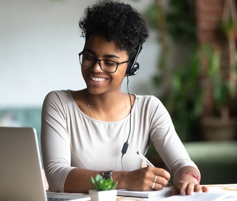 Woman On A Support Team Taking Note