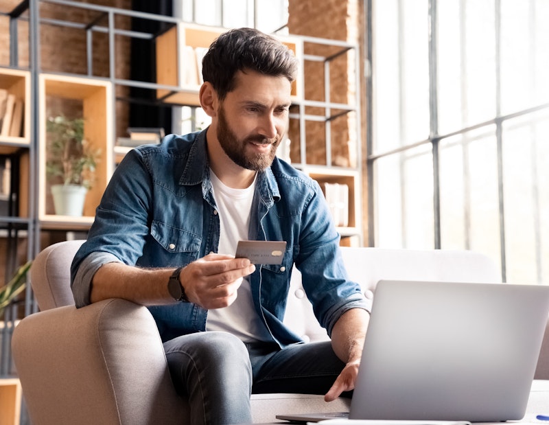 Man Paying Bill On Laptop