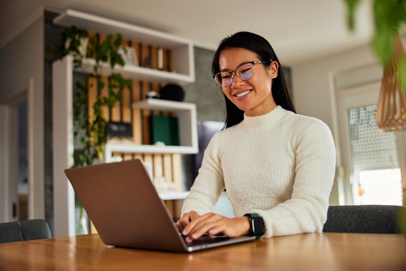Woman Using Laptop For Work