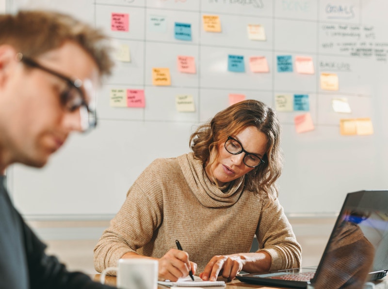 Man And Woman Working In A Conference Room